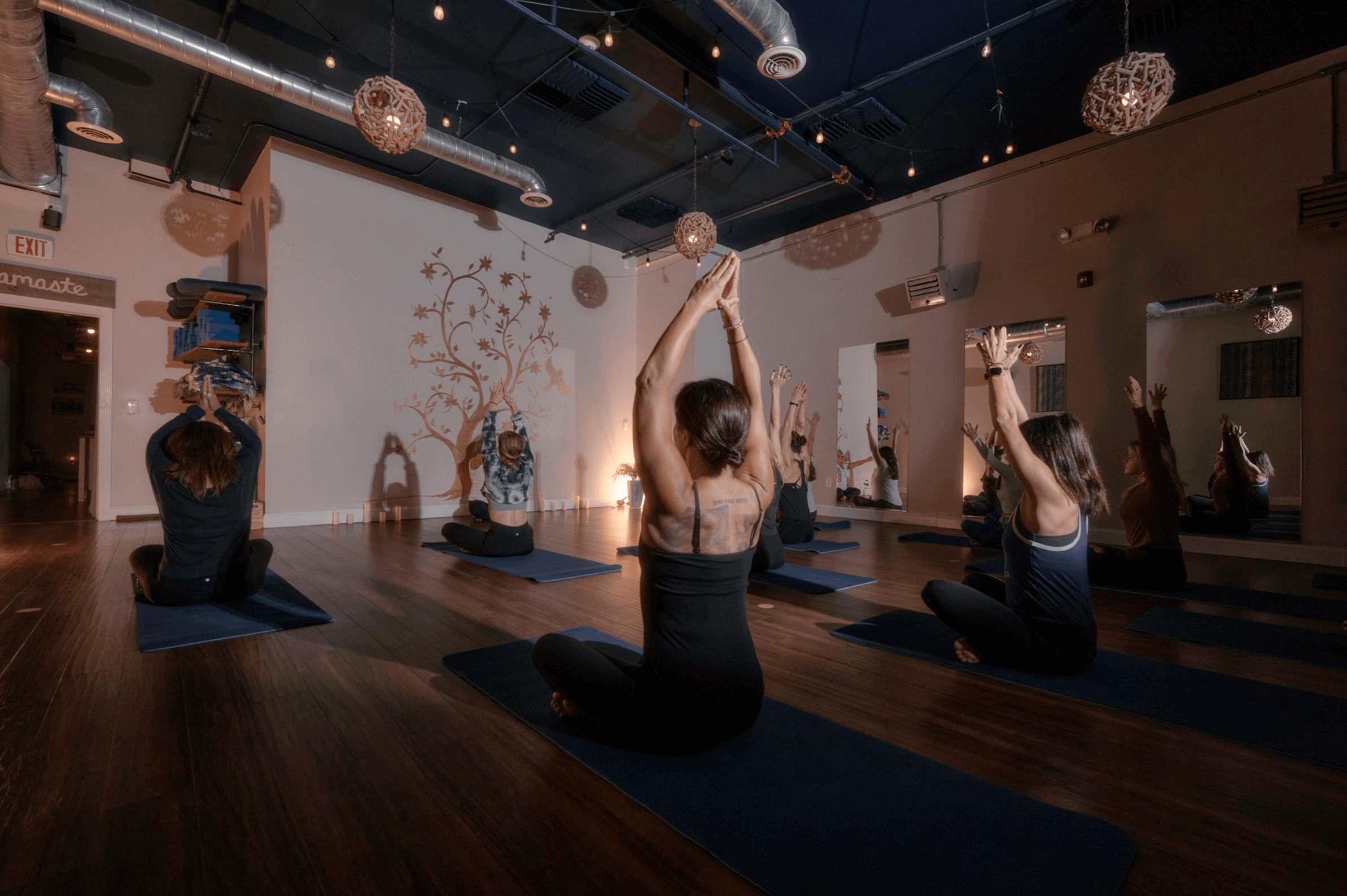 Yoga practitioner seated calmly in a peaceful studio setting